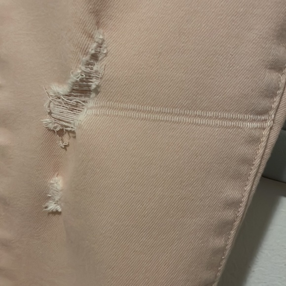 Peachy pink distressed skinny jeans. - Picture 2 of 3